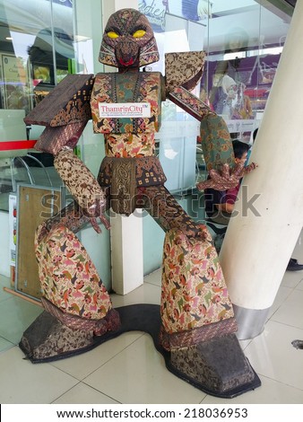 JAKARTA, WEST JAVA ISLAND, INDONESIA - SEPTEMBER 13, 2014: Giant batik robot model on display in Jakarta. Batik cloth is widely used by Indonesian and Asian people.