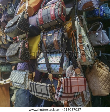 BANDUNG, WEST JAVA ISLAND, INDONESIA - SEPTEMBER 16, 2014: Large collection of famous fake handbags on display at one of the shopping centres in Bandung. Fake handbags are widely sold cheaply here.