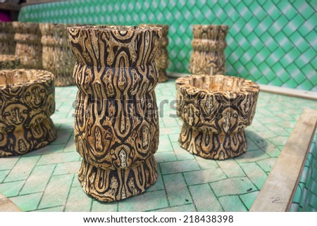 Wooden small vase on sale in Tangkuban Perahu, Indonesia. These wooden vase were made from special batik wood only grown here.