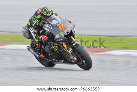 SEPANG,MALAYSIA-MARCH 1: Andrea Dovizioso of Monster Yamaha Tech 3 at 2012 MotoGP Official Winter Test Sepang 2 on Mar. 1, 2012 in Sepang, Malaysia.The 2012 MotoGP season starts on April 8 in Qatar.