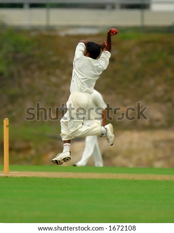 A cricket bowler ready and jumping to bowl
