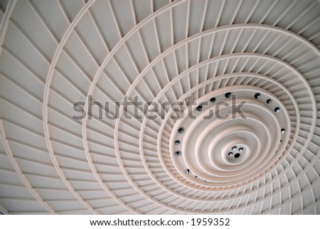 A close up view of spiral pattern on a ceiling