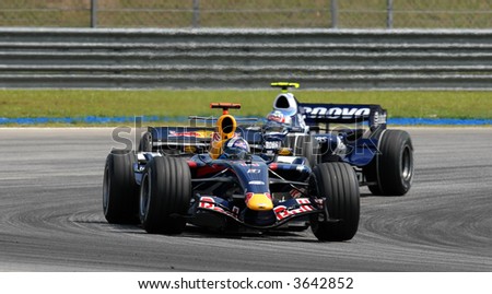 David Coulthard of Red Bull Racing defending his position with at turn Two at Sepang F1 Malaysia 2007 Grand Prix
