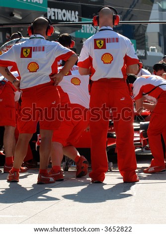Scuderia Ferrari crew practicing at pit stop