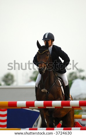A show jump horse trying to overcome hurdles at Premiercup Equestrian event in Putrajaya Malaysia