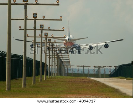 Stockphoto of an airplane landing on an airfield