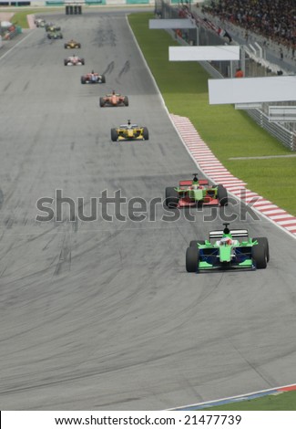 Motorsport cars race lining up before cornering.