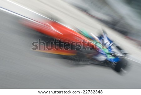 Motion blur of sports car at motorsports championship race.