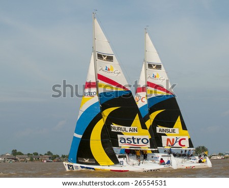 KUALA TERENGGANU, MALAYSIA - DEC 4 : Team Nurul Ain and Ben Ainslie in action at Monsoon Cup 2008 in K. Terengganu, Malaysia on December 4, 2008. Both teams did not qualify for quarter final.