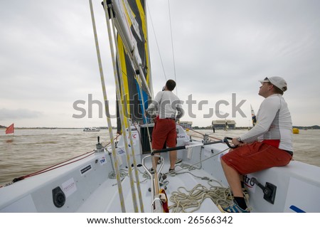 KUALA TERENGGANU, MALAYSIA - DEC 5 : Helmsman Johnie Berntsson (R) steers his boat at Monsoon Cup 2008 in K. Terengganu, Malaysia on December 5, 2008. Berntsson did not qualify for quarter final draw.