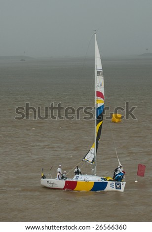 KUALA TERENGGANU, MALAYSIA - DEC 6 : An unidentified team sails back to jetty in stormy weather at Monsoon Cup 2008 in K. Terengganu, Malaysia on December 6, 2008.