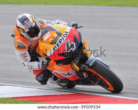 SEPANG, MALAYSIA - OCT 24 : Italian Andrea Dovizioso of Repsol Honda Team takes a corner during qualifying session at Shell Advance Malaysian Motorcycle Grand Prix on October 24, 2009 in Sepang