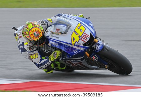 SEPANG, MALAYSIA - OCT 24 : Italian Valentino Rossi of Fiat Yamaha Team takes a corner during qualifying session at Shell Advance Malaysian Motorcycle Grand Prix on October 24, 2009 in Sepang