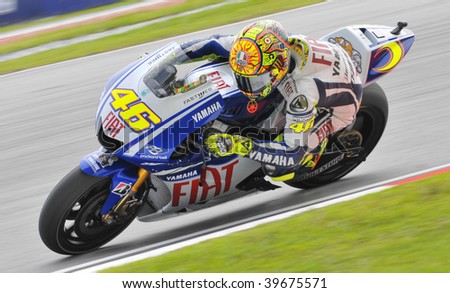 SEPANG, MALAYSIA - OCT 25 : Italian Valentino Rossi of Fiat Yamaha Team negotiates a corner during warm up session at Shell Advance Malaysian Motorcycle Grand Prix on October 25, 2009 in Sepang.
