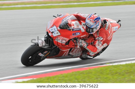 SEPANG, MALAYSIA - OCT 25 : American Nicky Hayden of Ducati Marlboro Team negotiates a corner during warm up session at Shell Advance Malaysian Motorcycle Grand Prix on October 25, 2009 in Sepang.