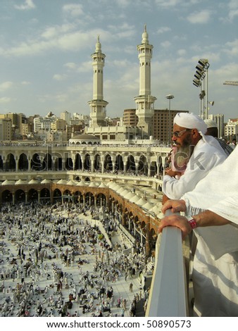 MECCA - DEC 8 : A Muslim watch pilgrims get ready for prayer from third floor of Haram Mosque Dec 8, 2007 in Mecca. Millions of muslims around the world come here for hajj during this time.