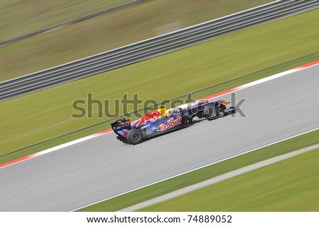 SEPANG, MALAYSIA - APRIL 8: Panning shot of Mark Webber of Red Bull Racing at PETRONAS Malaysian Grand Prix on April 8, 2011 in Sepang, Malaysia. The race will be held on Sunday April 10, 2011.
