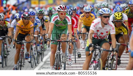 KUALA LUMPUR, MALAYSIA-FEB 12: An unidentified group of cyclists in action at the final stage of  le Tour de Langkawi on February 12, 2006 in Kuala Lumpur. 119 cyclists took part in this yearly event.