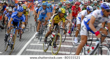 KUALA LUMPUR, MALAYSIA-FEB 12: An unidentified group of cyclists in action at the final stage of  le Tour de Langkawi on February 12, 2006 in Kuala Lumpur. 119 cyclists took part in this yearly event.