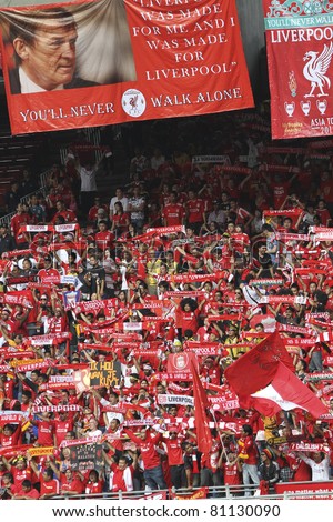 KUALA LUMPUR - JULY 16 : Liverpool football club fans sing 'You'll never walk alone' during a friendly match against Malaysia XI on July 16, 2011 in Kuala Lumpur, Malaysia. Liverpool won 6-3.