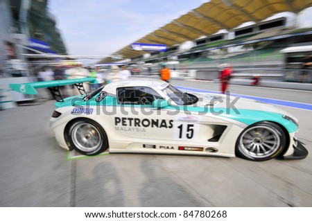 SEPANG, MALAYSIA-SEPT 16:PETRONAS Syntium Team driver in Mercedes SLS car exits garage at GT Class qualifying session of Malaysia Merdeka Endurance Race (MMER) 2011 in Sepang, Malaysia on 16, 2011