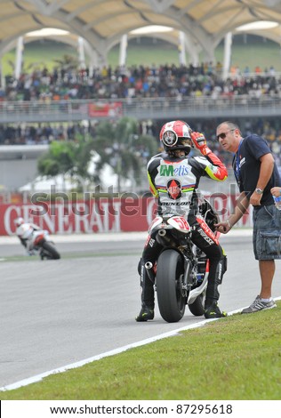 SEPANG,MALAYSIA-OCT 25:Italian Marco Simoncelli of Metis Gilera at 250cc Shell Advance Malaysian MotoGP on October 25, 2009 in Sepang.Simoncelli died at accident in the Motogp race on Oct. 23, 2011