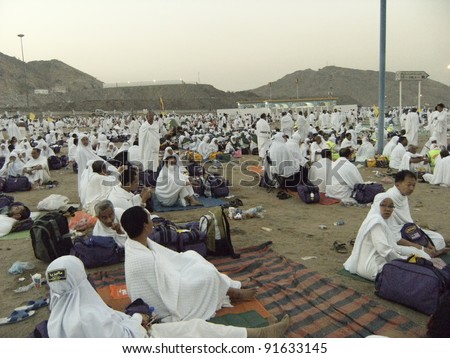 MUZDALIFAH, SAUDI ARABIA - DEC 19 :Muslim pilgrims take a rest at dawn on Dec 19, 2007 in Muzdalifah, S. Arabia. Millions of muslims around the world perform hajj during this time.