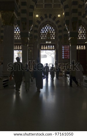 AL MADINAH, KINGDOM OF SAUDI ARABIA-FEB. 17: Unidentified Muslim men exit Masjid Nabawi after prayer on February 17, 2012 in Al Madinah, S. Arabia. Nabawi mosque is the 2nd holiest mosque in Islam