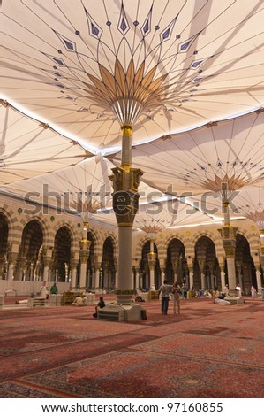 AL MADINAH, SAUDI ARABIA-FEB. 17: An unidentified worker cleans up and tidy up interior of Masjid Nabawi on February 17, 2012 in Al Madinah, S. Arabia. Nabawi mosque is the 2nd holiest mosque in Islam