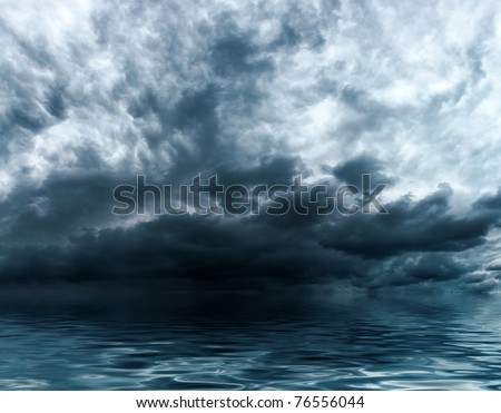 Blue storm clouds on a sky background over water surface