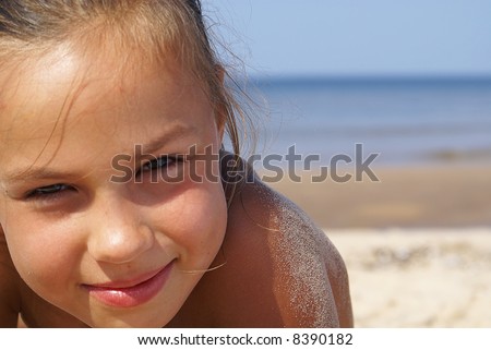 stock photo Beautiful preteen girl on a beach