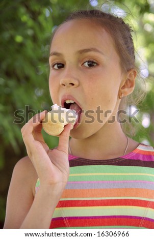 stock photo Preteen girl eats icecream