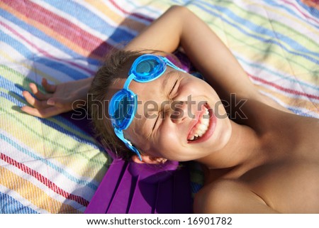 stock photo Preteen girl enjoying sunbath on sea beach