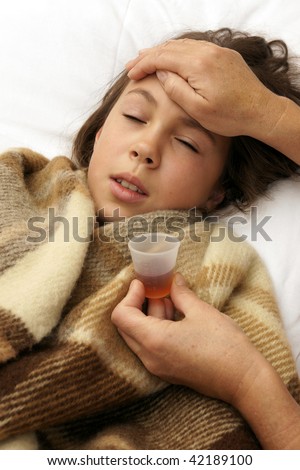 Sick preteen girl takes medicine
