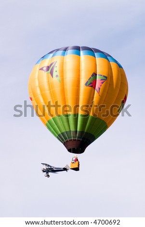 Hot Air Balloon and biplane at hot air balloon festival