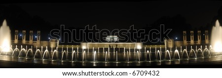 A panorama of the Lincoln Memorial at night with the World War 11 Memorial in the foreground, Washington, DC.