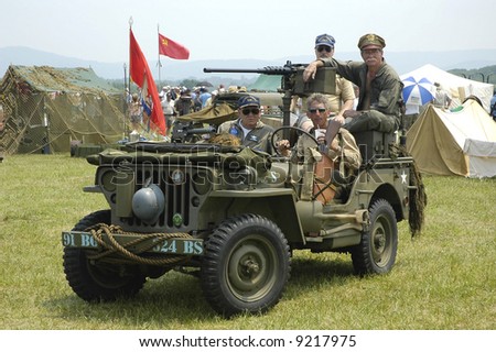 US Army World War 11 Jeep and reenactors portraying US Army troops.