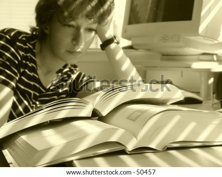 Girl is reading big books
