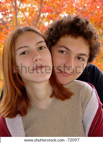 Autumn portrait of 2 teenagers
