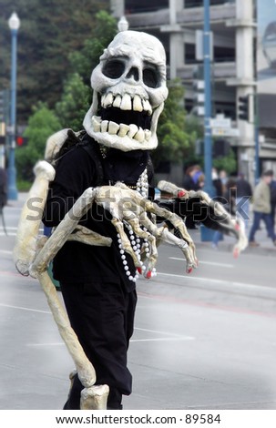 Skeleton waking on the street