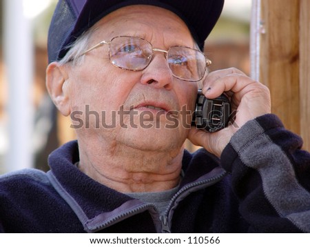 An old man talking on the phone