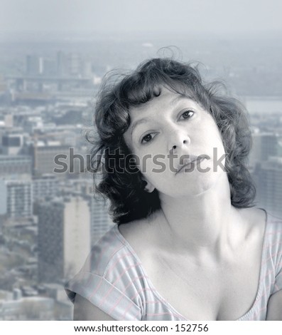 Attractive woman daydreaming against the distant city