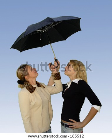 2 women under the umbrella
