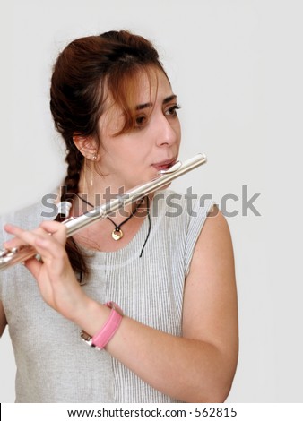 Beautiful woman playing flute