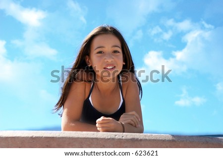 stock photo Asian teen girl against the sky