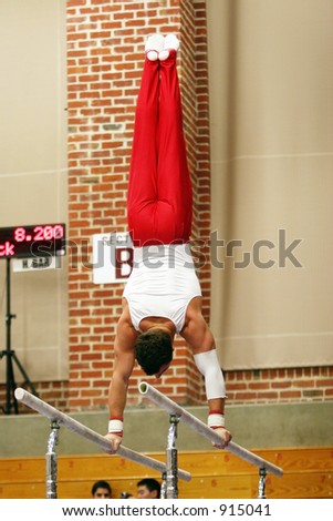 Gymnast competing on parallel bars