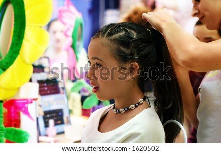 A girl getting her hair done
