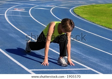 Woman exercising on a blue racetrack