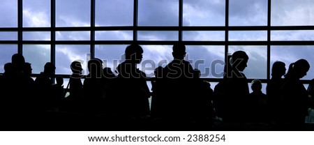 People waiting in line at the airport silhouette