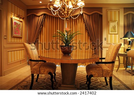 Luxury living room with table and two chairs